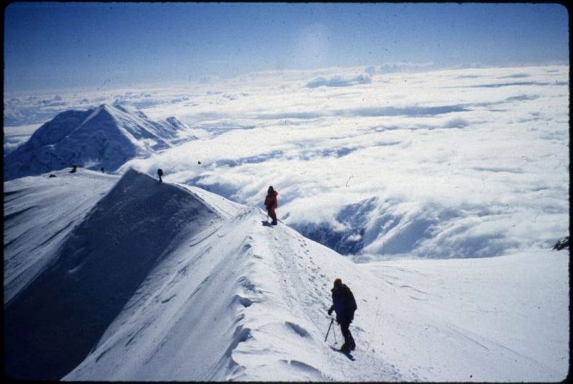 Stacy Taniguchi and another climber are pictured on the ridge line of Denali.
