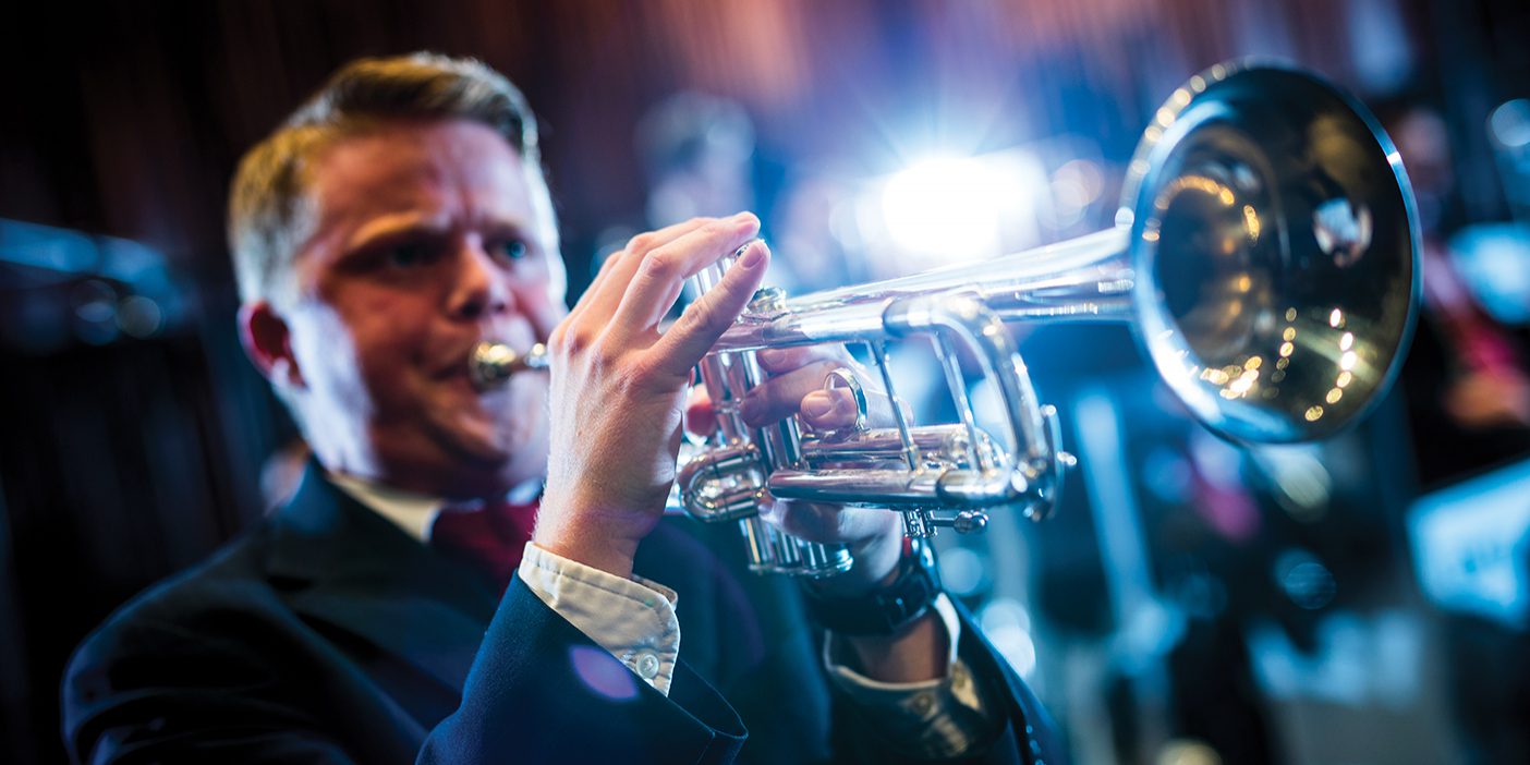 Joseph Palmer blows his trumpet at a BYU Jazz concert.