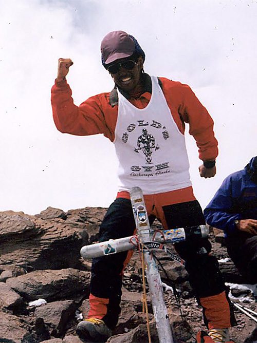 Stacy Taniguchi stands on Aconcagua.