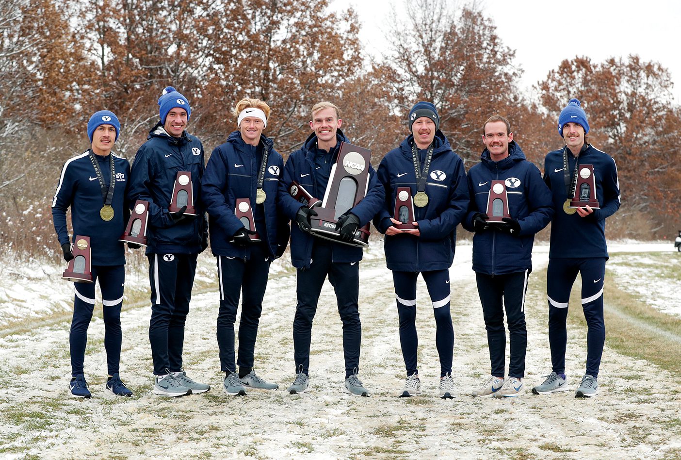 The BYU men's cross country hold their National awards. From left to right: Conner B. Mantz ('22), Jacob Heslington ('20), Rory E. Linkletter ('19), Clayton A. Young ('19), Connor R. McMillan ('19), Brayden T. McLelland ('20), Clayson K. Shumway ('21)