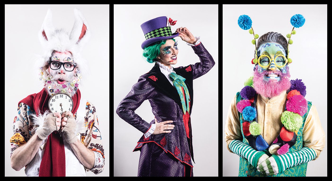 Three theater students, playing the White Rabbit, the Mad Hatter, and the Caterpillar, in costume for Wonderland.