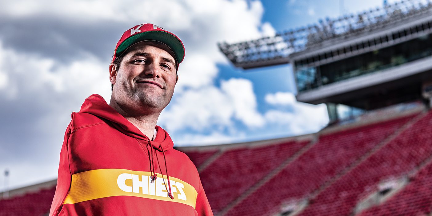 In a red Chiefs sweatshirt, Porter Ellett smiles at the camera.