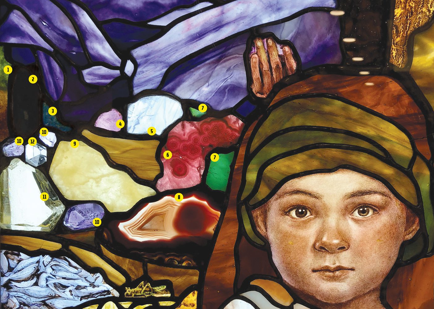 A picture of part of the stained-glass mural in the Rome Italy Temple Visitors' Center showing rocks from all over the world.