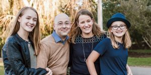 Melody Warnick next to her husband and her two daughters.
