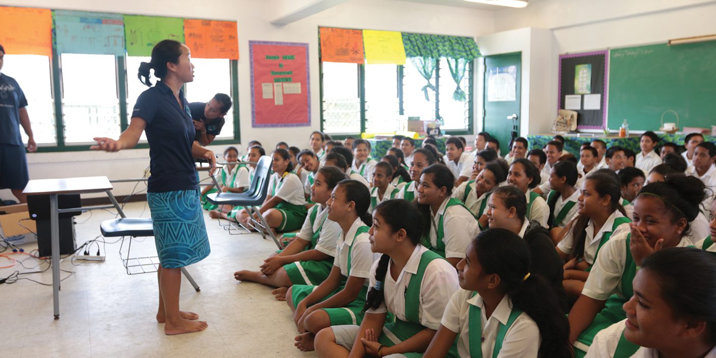 Linda Furuto teaches in front a group of Polynesian students.