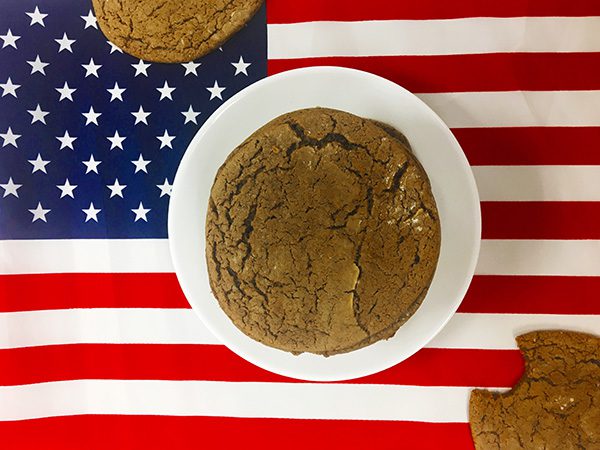 a picture of Joe Frogger molasses cookies on a plate on the American flag