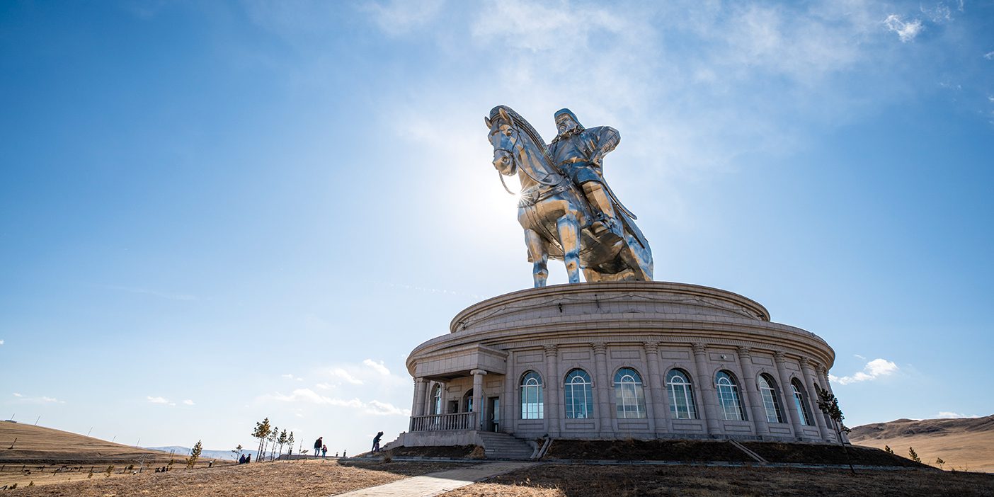 A round building with a 250-ton stainless steel statue of Genghis Khan on a horse.