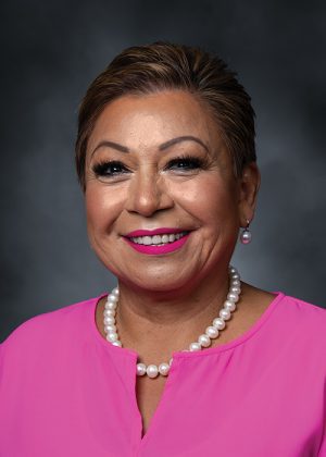 Headshot of Chelita De La Roca Pate.