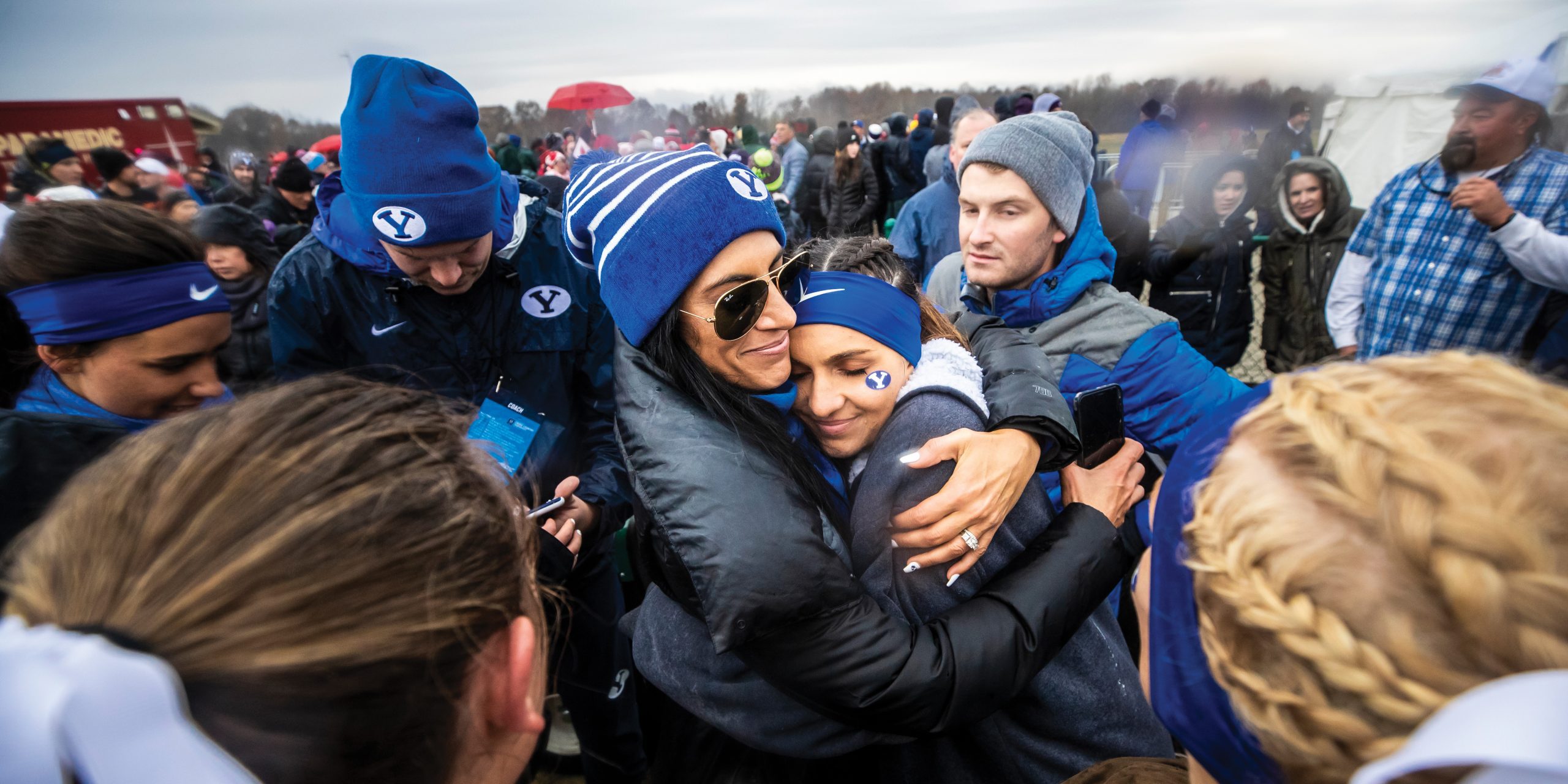 BYU women's cross country coach Diljeet Taylor hugs Whittni Orton after her seventh-place finish at the 2019 cross country national championships.