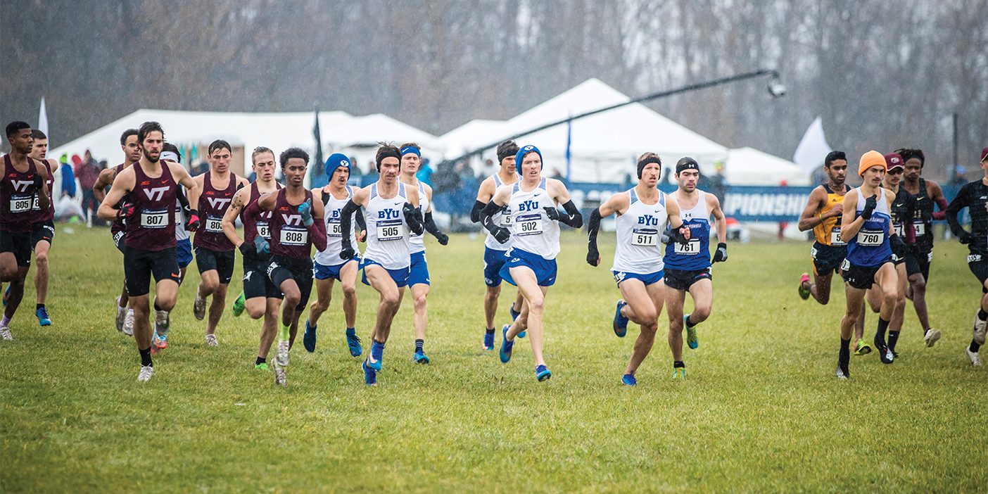 A pack of BYU men's cross country runners start off the 2019 national championship race near a group of Virginia Tech runners.