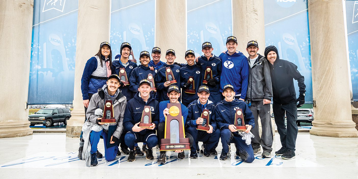 The BYU men's cross country team poses with their first-place trophy at the 2019 Cross Country National Championships.