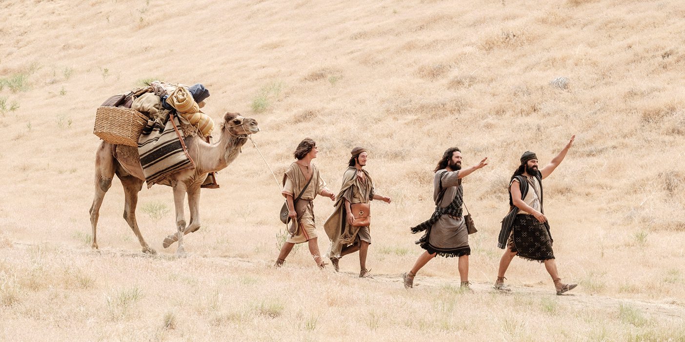 A photo from the filming of the Book of Mormon Videos shows Nephi's family walking across the landscape with a camel in tow.