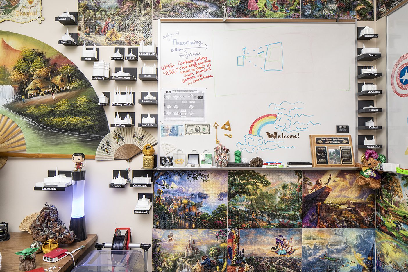 A corner of James Gaskin's office with 3D printed temples, Disney puzzles, and other knick knacks.