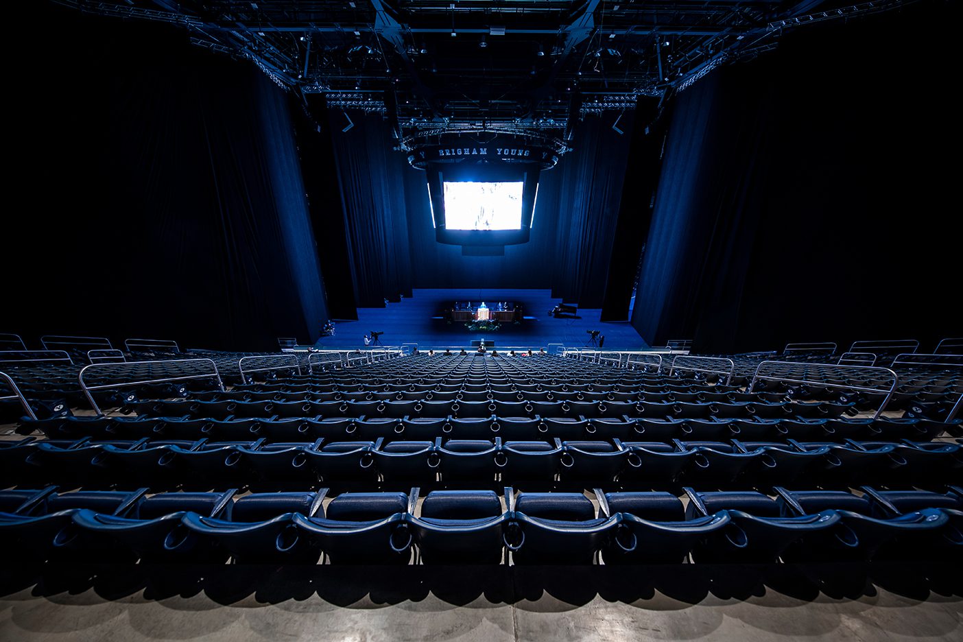 An empty Marriott Center at the devotional address of Elder Jack Gerard during COVID-19 restrictions on gathering sizes.