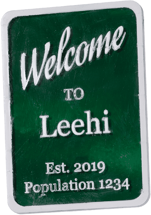 An image of a city sign made for a miniature city that reads, "Welcome to Leehi Est. 2019 Population 1234."