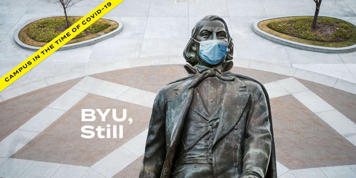 An opening image for a magazine article titled, "BYU, Still" shows an empty statue with the Brigham Young statue wearing a medical mask and yellow police tape that reads "Campus in the time of COVID-19"