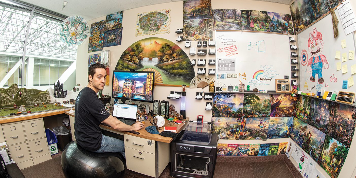 BYU information systems professor James Gaskin in his office in the Tanner Building. The walls and the office are covered in Disney puzzles, 3D printed temples, trinkets, and minerals/gems.