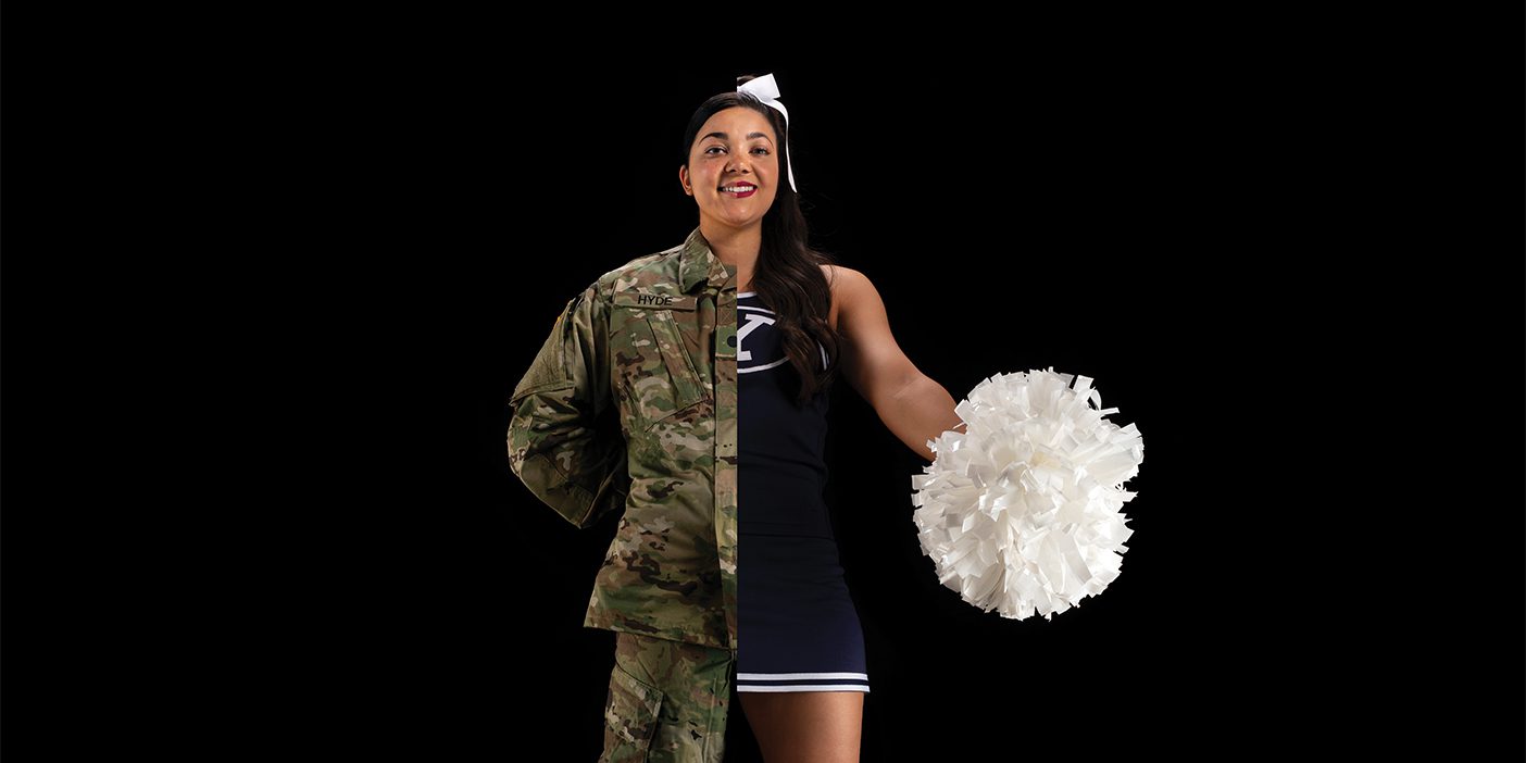 The photo is edited to show Jenae wearing her her ROTC fatigues on one half of her body and her cheer uniform on the other.