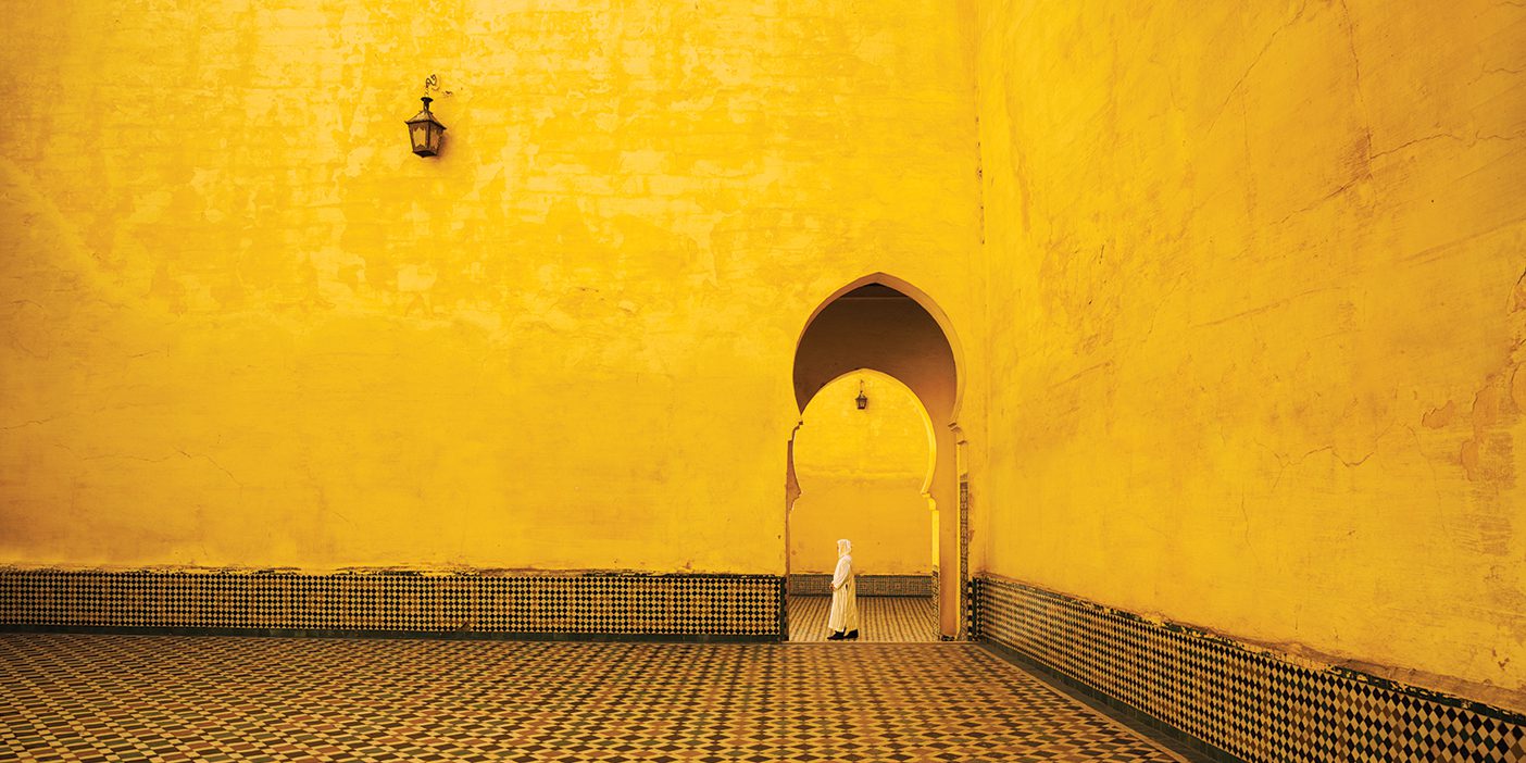A yellow Arabian-style doorway in a mosque in Morocco.