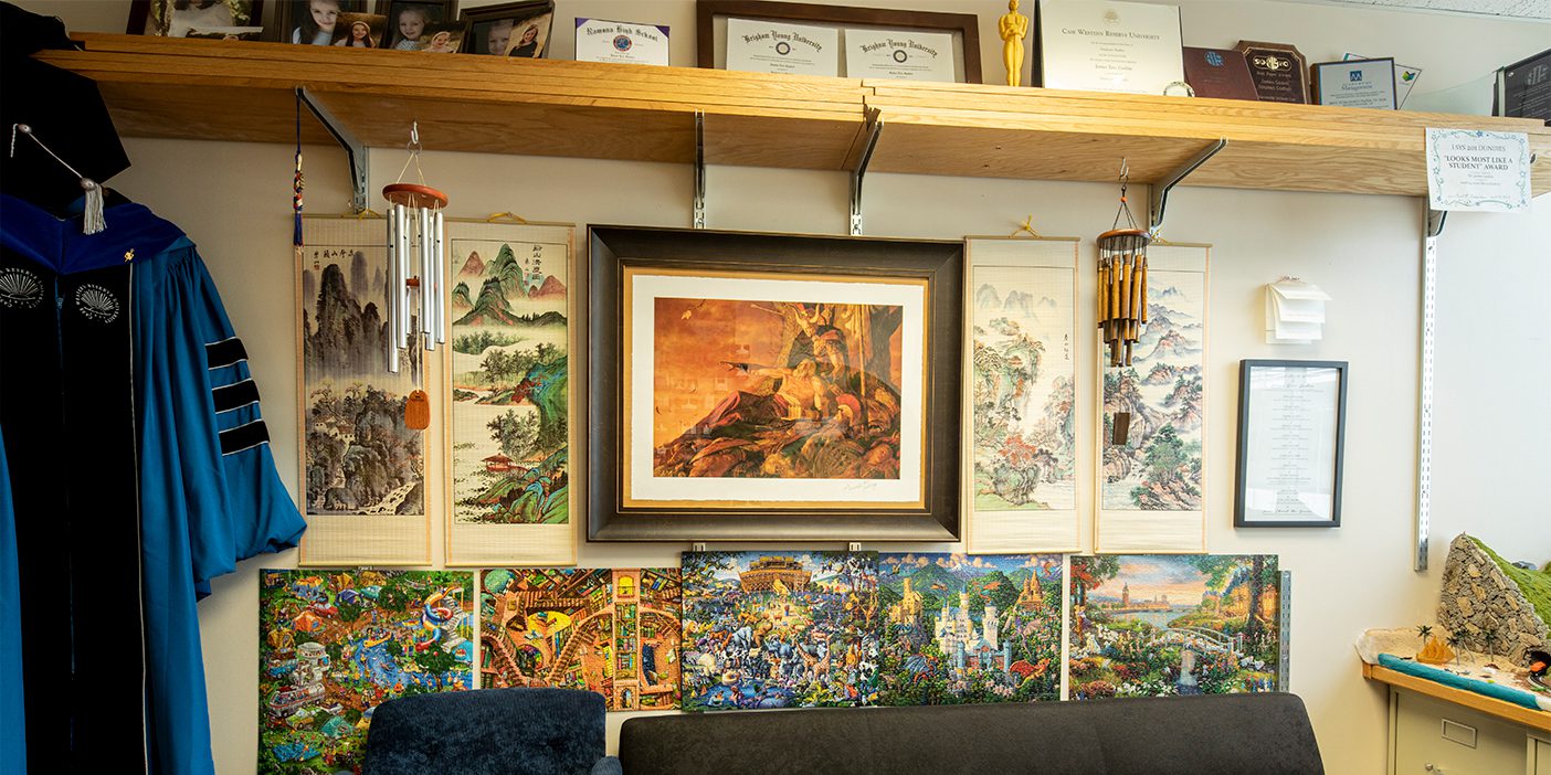 Part of James Gaskin's office with puzzles and paintings on the wall.