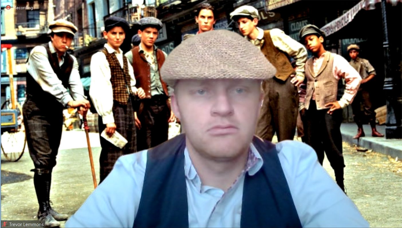 Trevor Lemmons dressed as a newsie on a Zoom call.