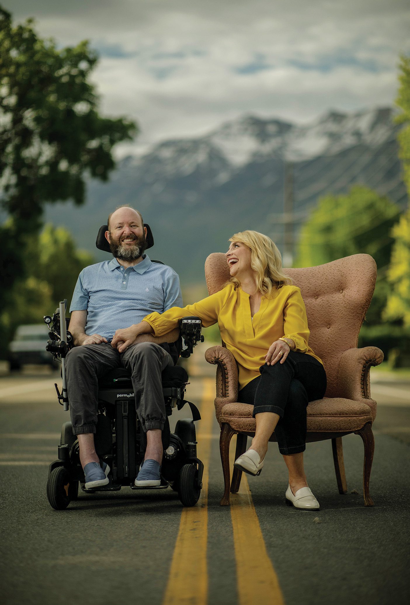 Chis and Lisa Clark, sitting on chairs in the middle of the street.