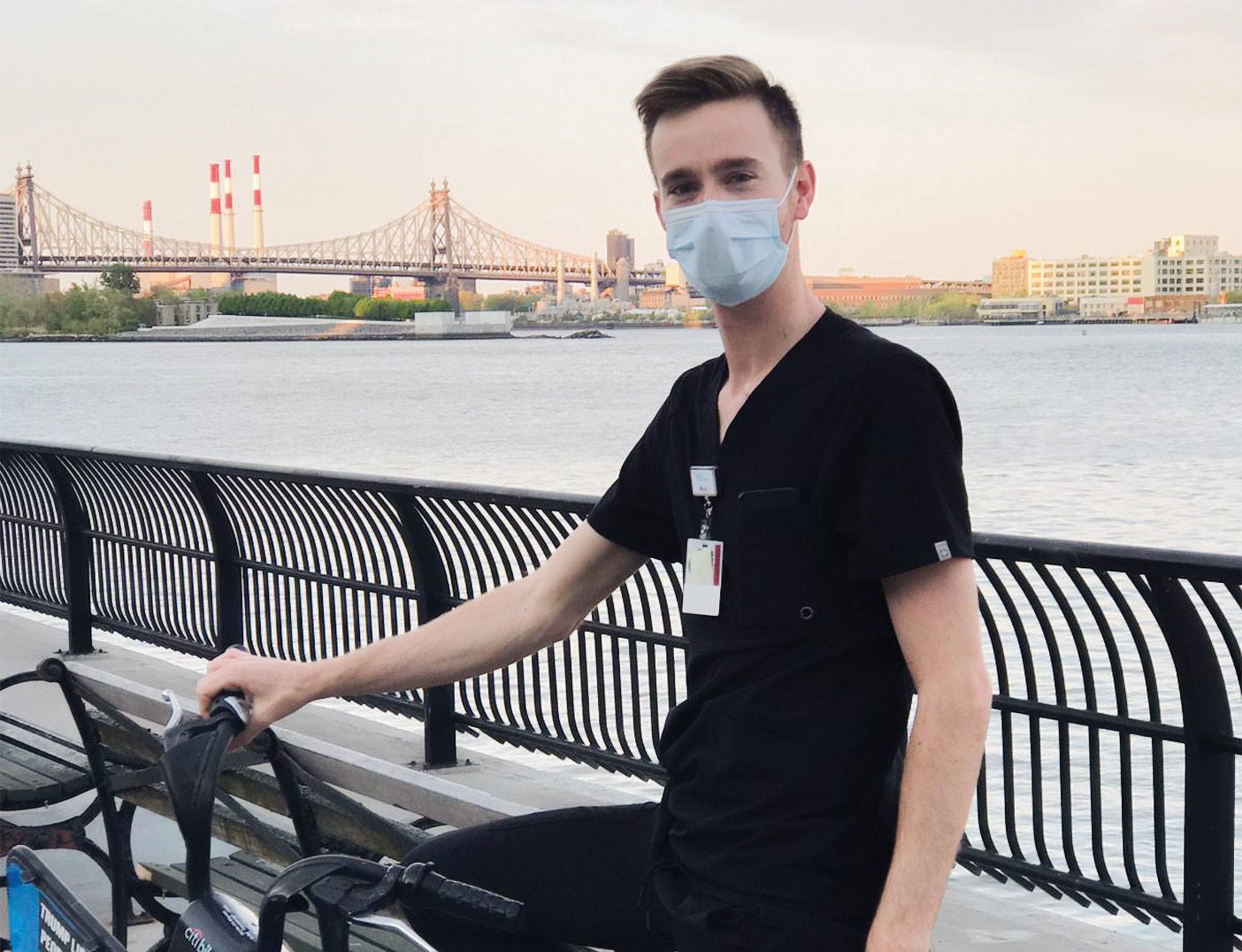 Daniel Wallentine poses in EMT scrubs in New York City.