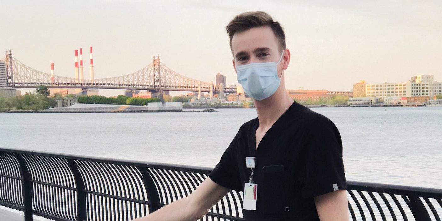 Daniel Wallentine poses in EMT scrubs in New York City.