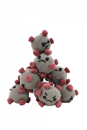 Stuffed virus toys with varying upset faces built into a pyramid tower.