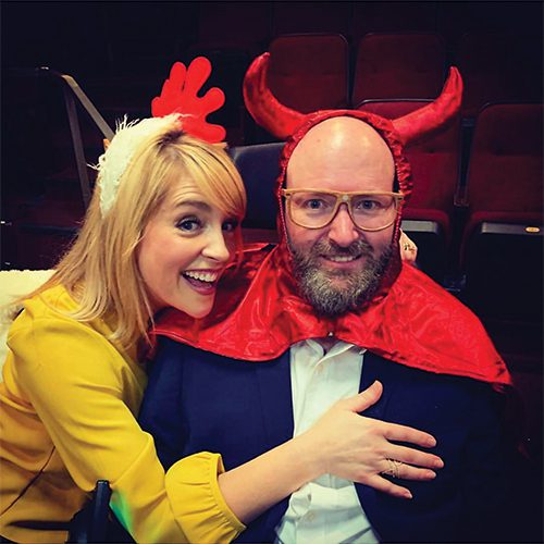 Lisa Clark with a chicken headband with her husband, Chris Clark, wearing a headband with devil horns.