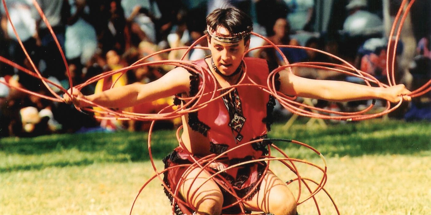 Joseph P. K. Ahuna III (BA &rsquo;03, JD &rsquo;08, MPA &rsquo;08) performs a Native American hoop dance at a multicultural festival in Hawaii.