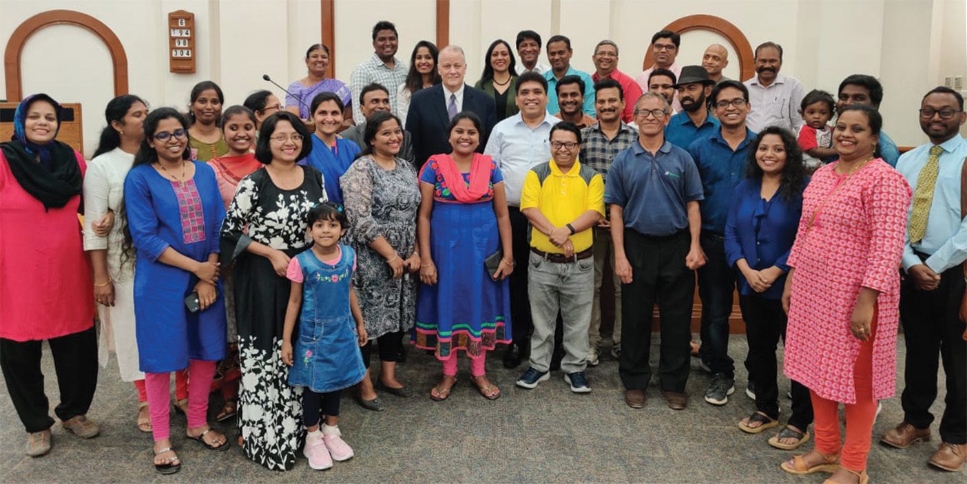 A gathering of Indian Latter-day Saints with Elder David P. Homer.