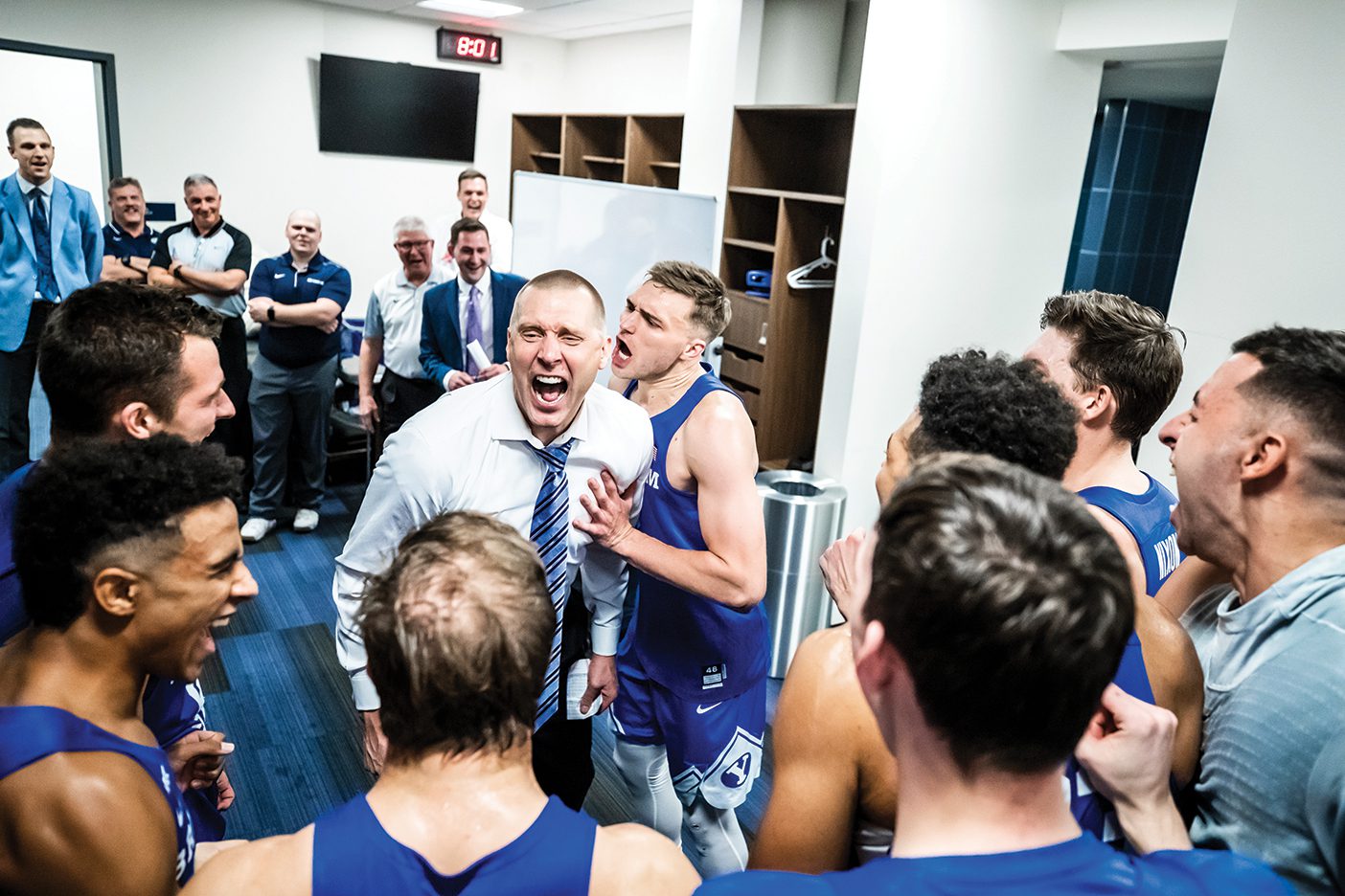 Mark Pope and Jake Toolson celebrate a big win against Gonzaga.