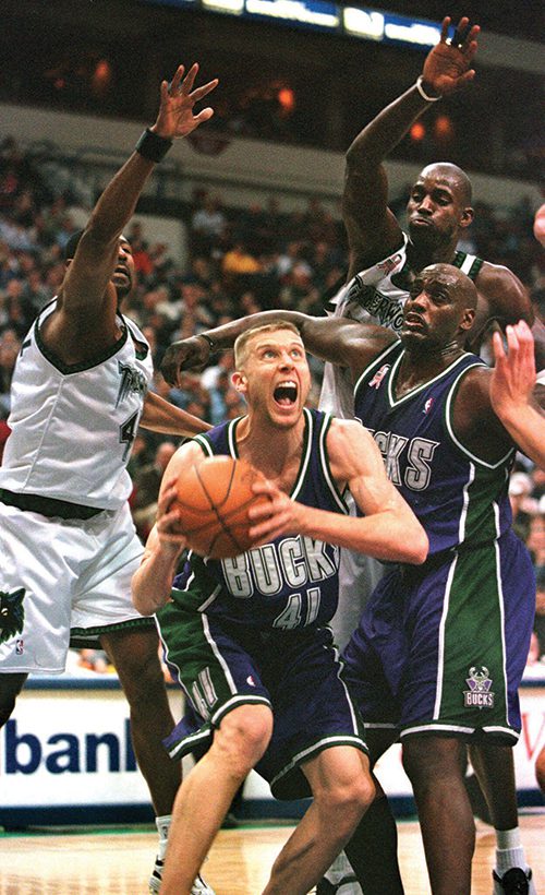 Mark Pope playing basketball with the Milwaukee Bucks.