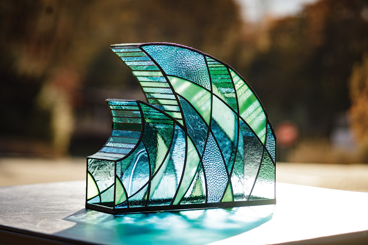 Glass sculpture of wave by Mike Bigelow