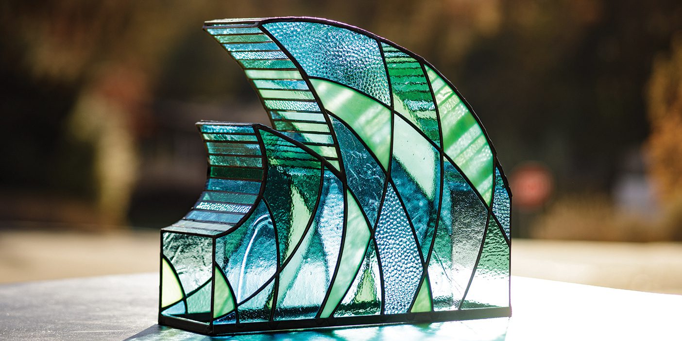 Glass sculpture of wave by Mike Bigelow