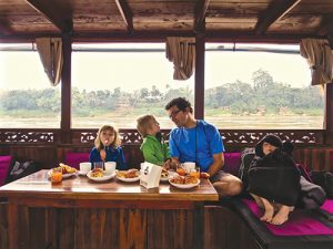Photo of Mitch Spence and children in Laos.