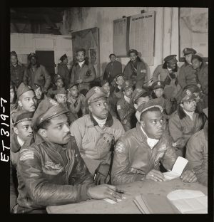 A sepia photo of a gathering of the Tuskegee Airmen.