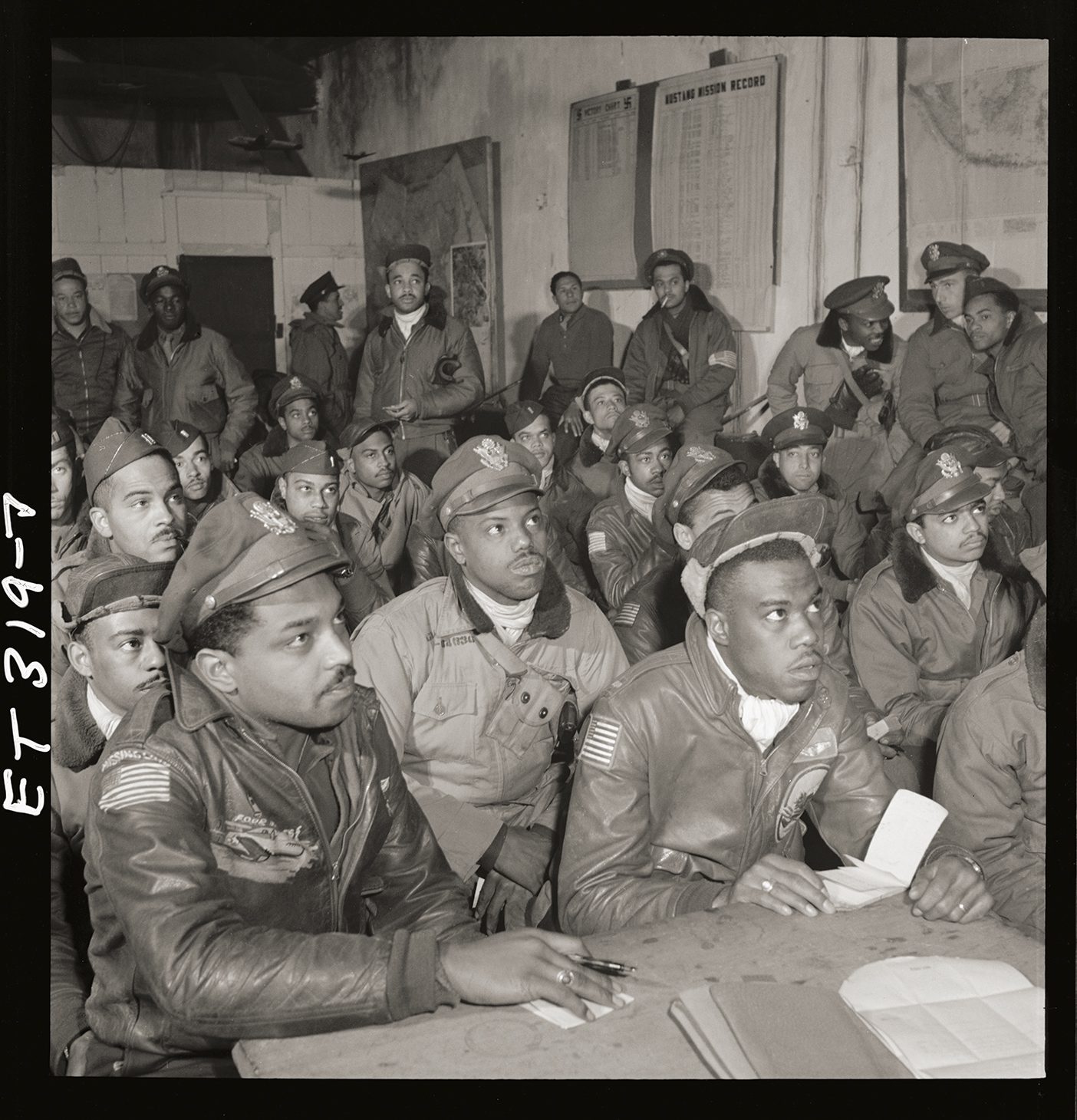 A sepia photo of a gathering of the Tuskegee Airmen.