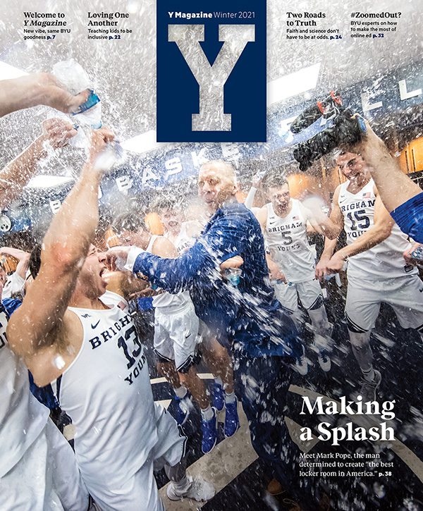 Cover of launch issue of Y Magazine shows a celebratory BYU men's basketball team in the locker room with Coach Mark Pope at the center.