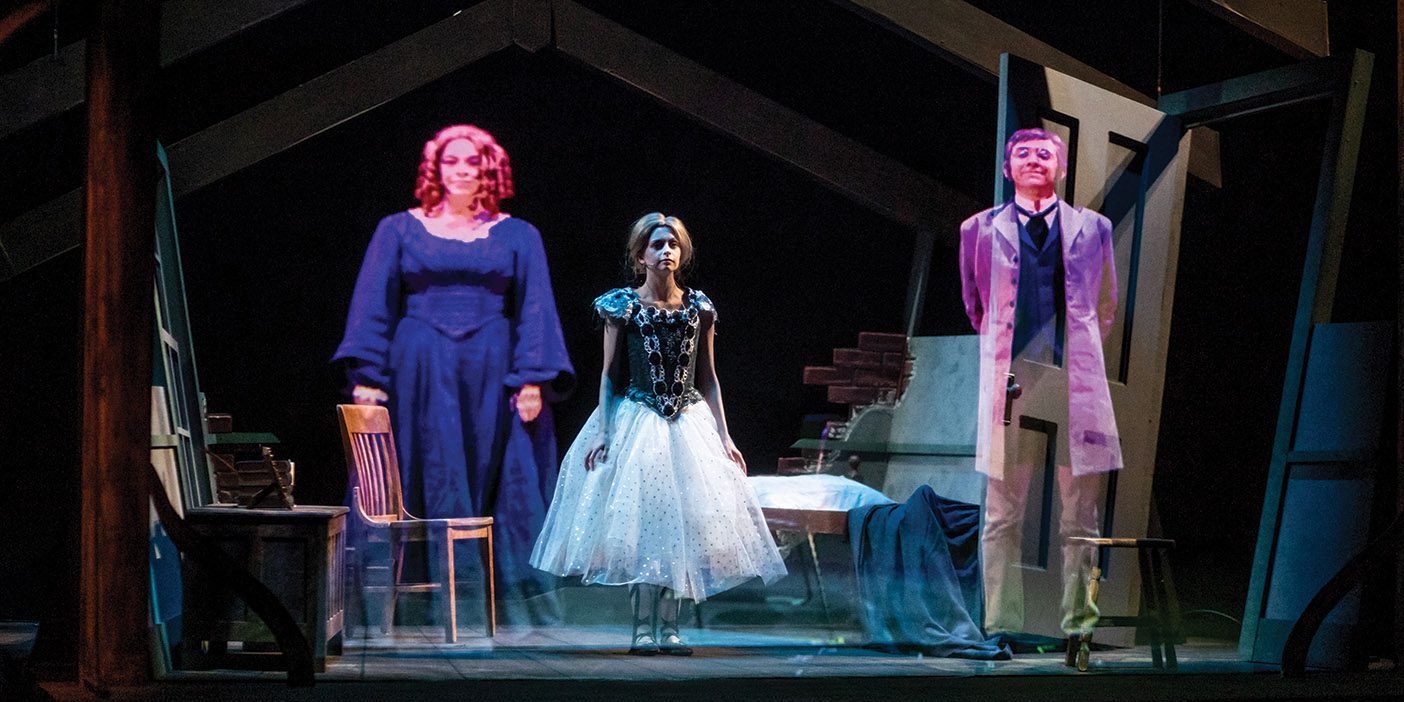 Ghostly projections of three BYU actors appear on stage during BYU's Illusionary Tales.