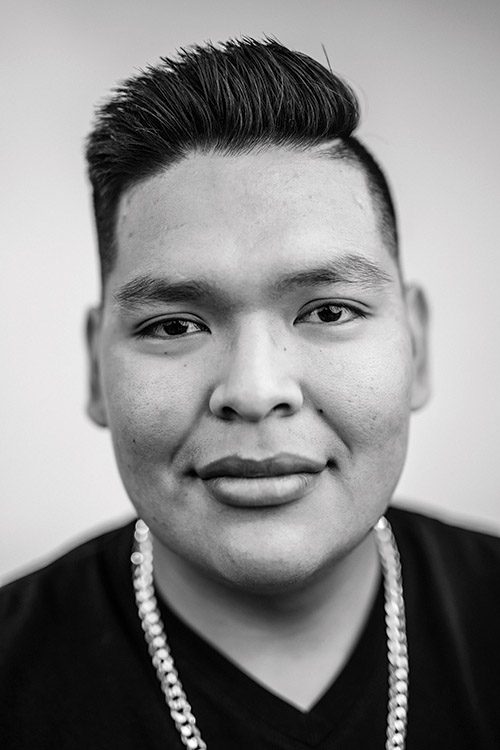 A black and white photo of a Native American, male BYU student.