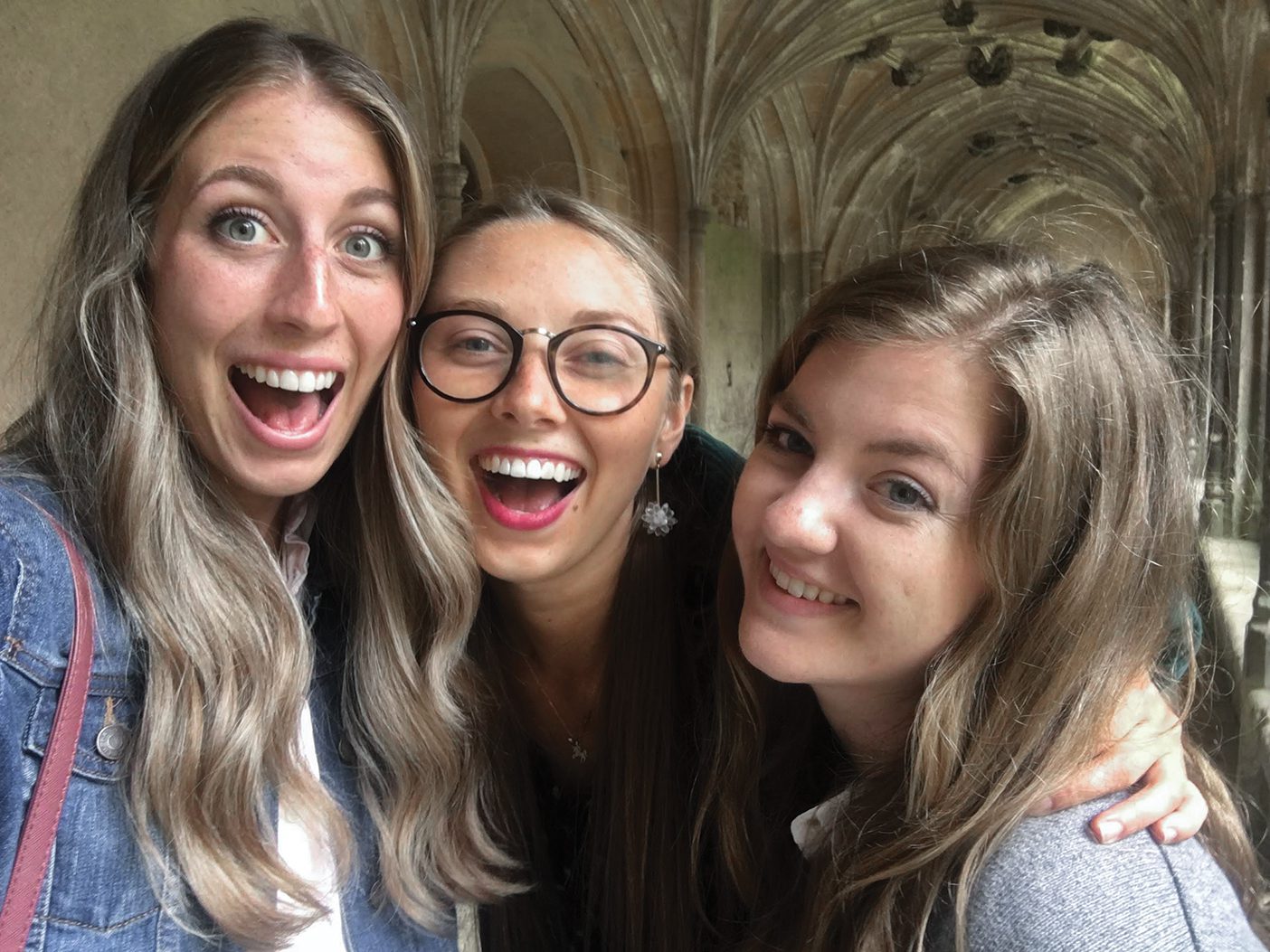 Devynn Dayton, Lexi Nilson, and Nicole Jacobson smiling brightly during their trip to England.