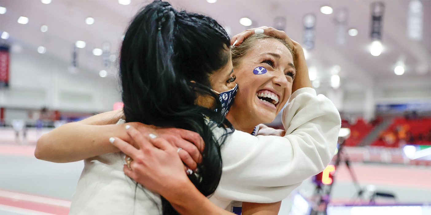 BYU track coach Diljeet Taylor hugs Courtney Wayment after winning a race at the NCAA indoor track championships.