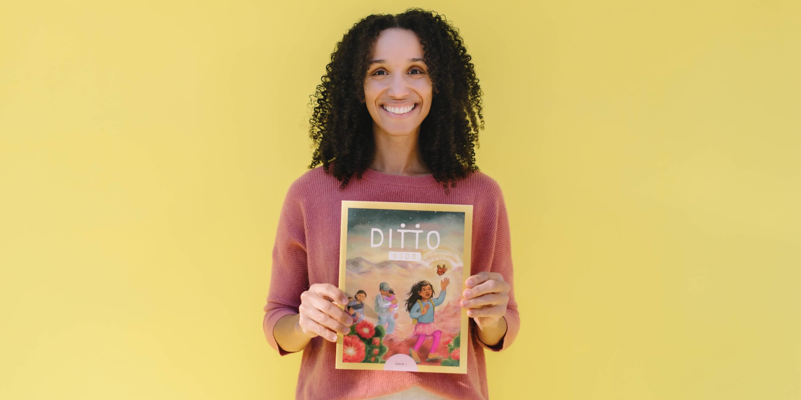 Alexandria Scott stands with her first issue of Ditto Kids magazine.