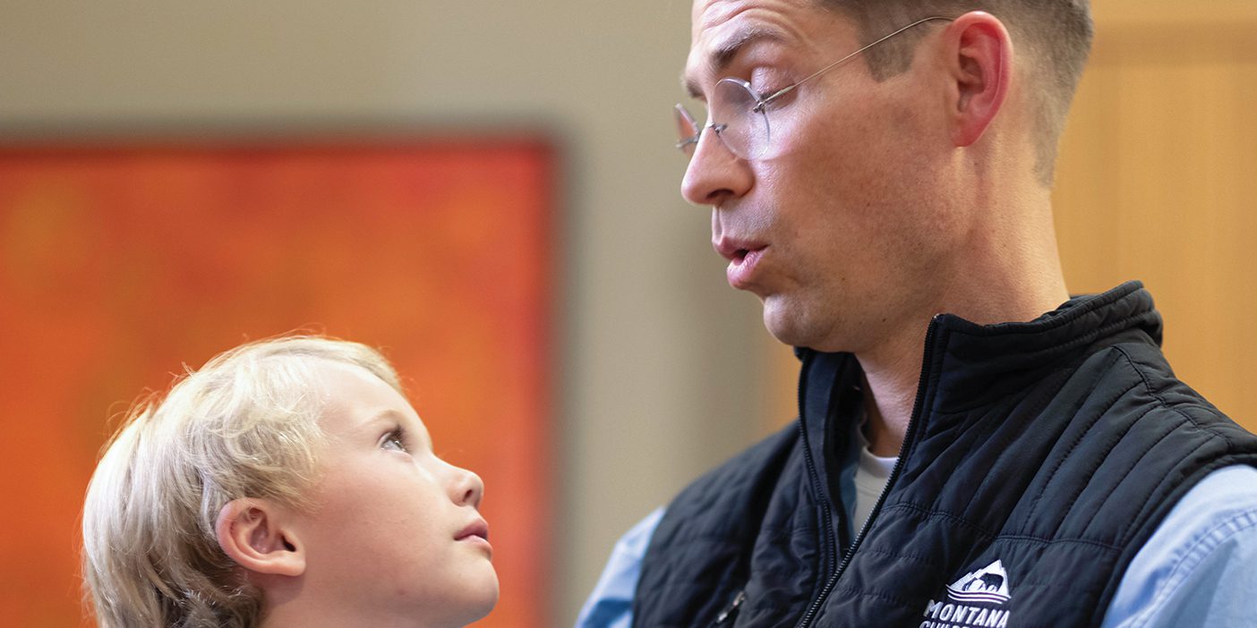 Dr. Adam Schow sings to a patient.