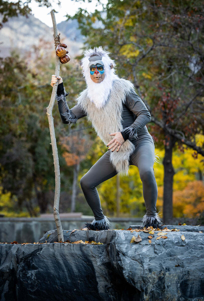 Man dressed as Rafiki, the baboon from Lion King.