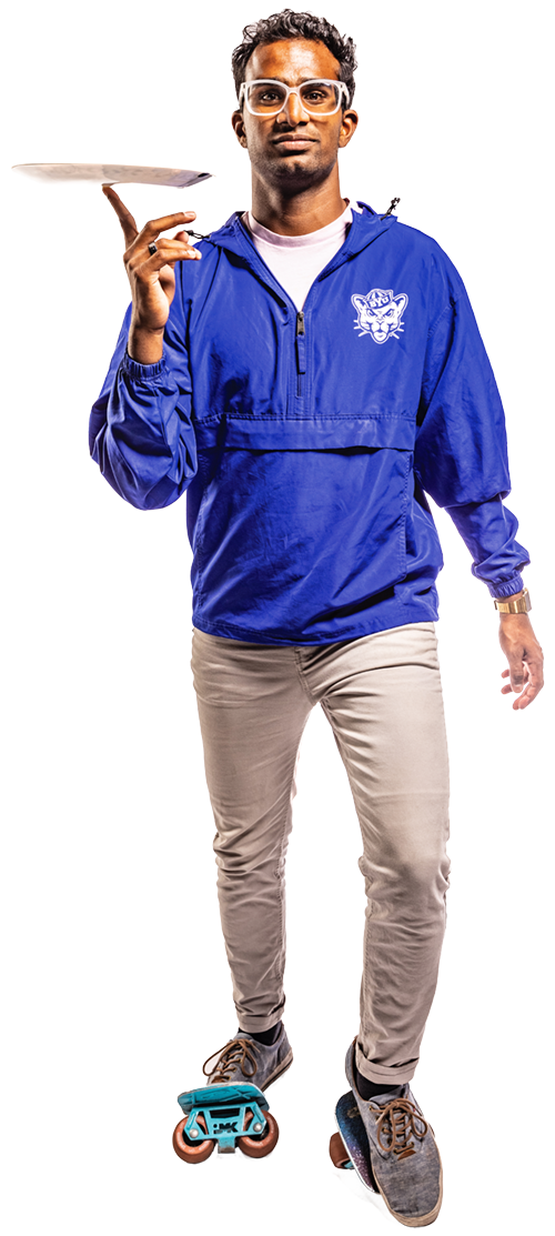 A male student wearing a blue BYU jacket spins a white dinner plate on one finger.