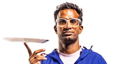 A male student wearing a blue BYU jacket spins a white plate on one finger.