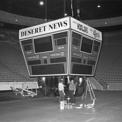 A black and white photo of a new scoreboard in the Marriott Center in 1983 controlled by a Mark 500 computer.